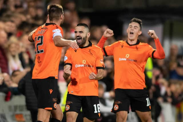 Dundee United's Aziz Behich celebrates scoring the opener in the 4-0 win over Aberdeen at Tannadice. (Photo by Mark Scates / SNS Group)
