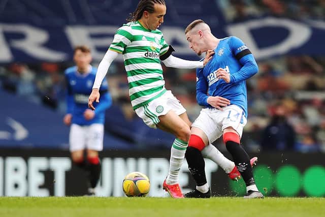 Diego Laxalt of Celtic vies with Ryan Kent of Rangers during the Scottish Cup game between Rangers and Celtic at Ibrox Stadium on April 18, 2021 in Glasgow, Scotland. Sporting stadiums around the UK remain under strict restrictions due to the Coronavirus Pandemic as Government social distancing laws prohibit fans inside venues resulting in games being played behind closed doors. (Photo by Ian MacNicol/Getty Images)