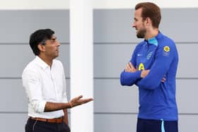 Britain's Prime Minister Rishi Sunak (L) talks with England striker Harry Kane back in October.