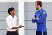 Britain's Prime Minister Rishi Sunak (L) talks with England striker Harry Kane back in October.