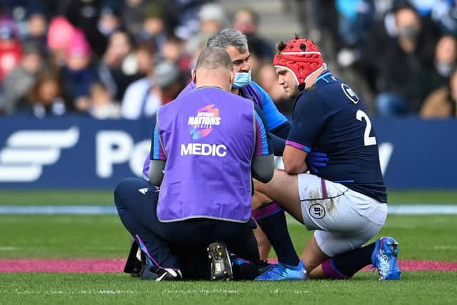George Turner receives treatment for the rib injury that forced the Scotland hooker off against Australia. (Photo by Paul Devlin / SNS Group)