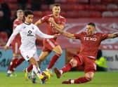 Aberdeen forward Christian Ramirez tries to close down Ross County's Yan Dhanda during the 0-0 draw at Pittodrie.
