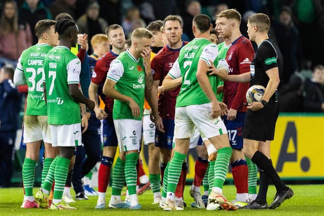 Hibs' Lewis Miller and Kilmarnock's Marley Watkins have a heated exchange at full time. (Photo by Mark Scates / SNS Group)