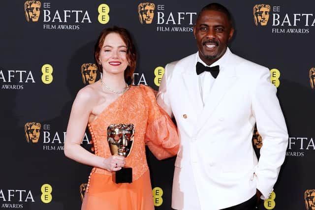 Emma Stone with Idris Elba after winning the Best Leading Actress award for 'Poor Things' during the Bafta Film Awards 2024. Image: Ian West/PA Wire