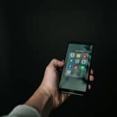 iPhone with social media apps showing