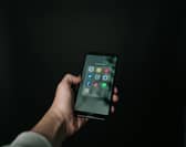 iPhone with social media apps showing
