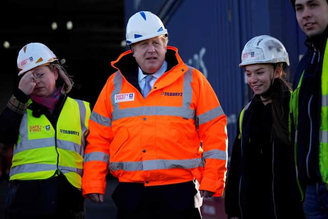 British Prime Minister Boris Johnson (centre) visits Tilbury Docks in Tilbury. Picture: Matt Dunham/AFP via Getty Images