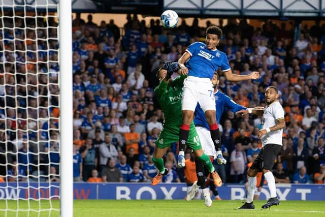 Rangers' Malik Tillman rises above Union's Anthony Moris to make it 3-0 to Rangers.