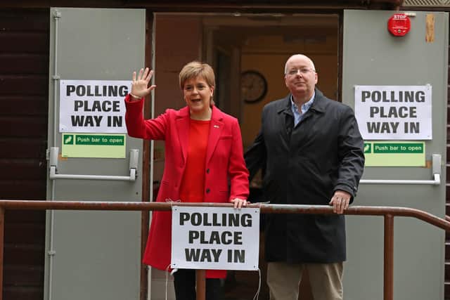 SNP leader Nicola Sturgeon and chief executive of the SNP Peter Murrell leave a polling station at Broomhouse Park Community Hall in Edinburgh after casting their votes for the European Parliament elections. Picture: Andrew Milligan/PA Wire