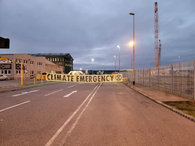 Protesters from Extinction Rebellion Scotland block the Invergordon oil rig maintenance facility.
