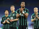 Moritz Jenz and the rest of the Celtic players applaud the travelling fans at the end of the 5-1 defeat to Real Madrid in the Bernabeu. (Photo by THOMAS COEX/AFP via Getty Images)