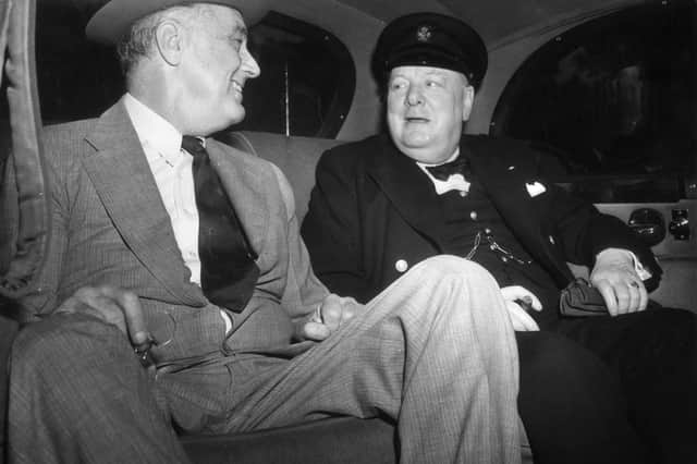 Winston Churchill and Franklin Roosevelt in a car on their way to the White House in Washington to discuss the Allied Victory in North Africa during the Second World War.   (Picture: Topical Press Agency/Getty Images)
