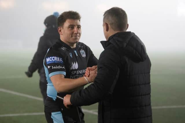 Glasgow's Duncan Weir (L) and head coach Danny Wilson at full time during a European Champions Cup match between Glasgow Warriors and Exeter Chiefs at Scotstoun. (Photo by Ross Parker / SNS Group)