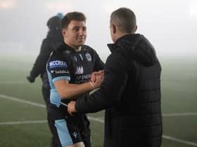 Glasgow's Duncan Weir (L) and head coach Danny Wilson at full time during a European Champions Cup match between Glasgow Warriors and Exeter Chiefs at Scotstoun. (Photo by Ross Parker / SNS Group)