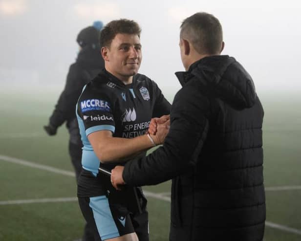 Glasgow's Duncan Weir (L) and head coach Danny Wilson at full time during a European Champions Cup match between Glasgow Warriors and Exeter Chiefs at Scotstoun. (Photo by Ross Parker / SNS Group)