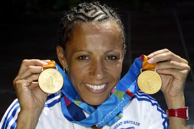 Double gold medal winner Kelly Holmes celebrates after her 800m and 1500m victories at the Athens 2004 Olympic Games.
