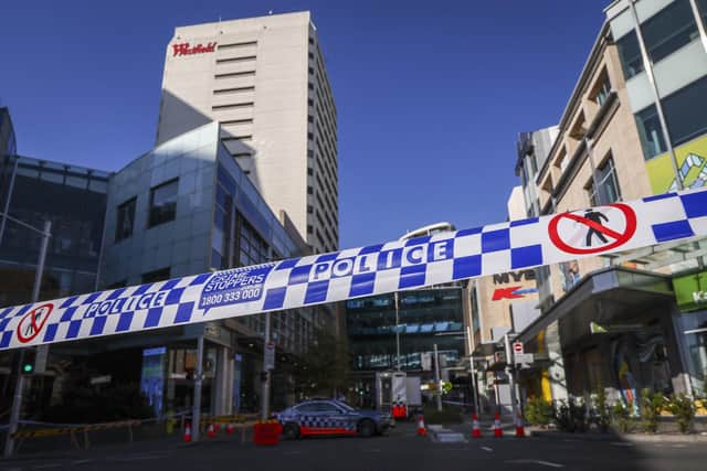 Police tape can be seen in front of a roadblock outside the Westfield Bondi Junction shopping mall in Sydney. Picture: David Gray/AFP via Getty Images