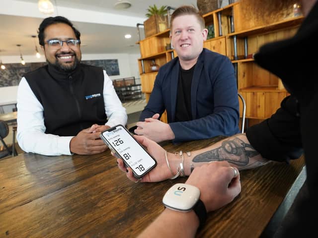 Novosound CEO and co-founder Dave Hughes (pictured centre) with the firm's ultrasound blood pressure monitor. Picture by Stewart Attwood