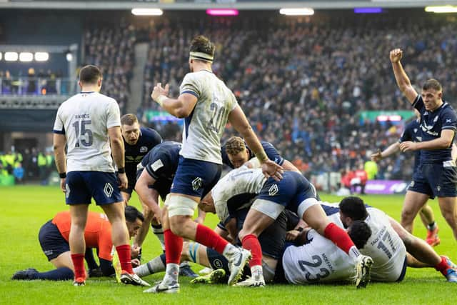 Berry tries to peer into the ruck to determine whether Sam Skinner had grounded the ball.