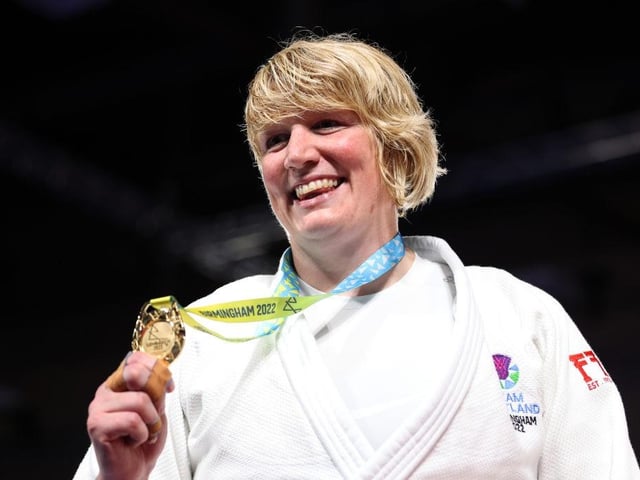 Sarah Adlington receives her gold medal after winning the Women's Judo +78 kg.