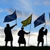 Duncan Thomson, Brian McCutcheon, John Patterson and Arthur Murdoch hold Scottish flags as they prepare to vote in the Scottish independence referendum on September 14, 2014 PIC: Picture: Jeff J Mitchell/Getty Images