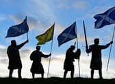 Duncan Thomson, Brian McCutcheon, John Patterson and Arthur Murdoch hold Scottish flags as they prepare to vote in the Scottish independence referendum on September 14, 2014 PIC: Picture: Jeff J Mitchell/Getty Images