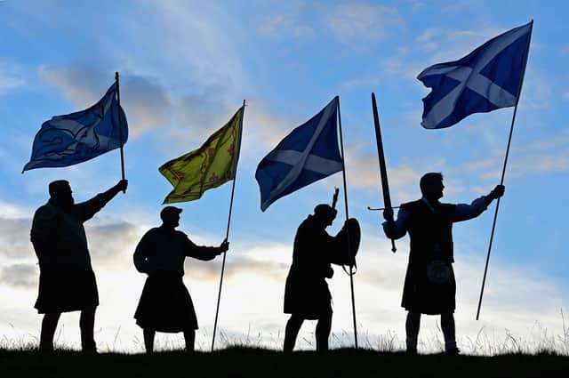 Duncan Thomson, Brian McCutcheon, John Patterson and Arthur Murdoch hold Scottish flags as they prepare to vote in the Scottish independence referendum on September 14, 2014 PIC: Picture: Jeff J Mitchell/Getty Images