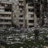 A Ukrainian serviceman walks amid the rubble of a building heavily damaged by multiple Russian bombardments near a frontline in Kharkiv, Ukraine, Picture date, April 25