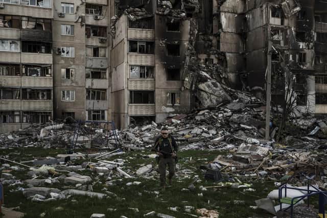A Ukrainian serviceman walks amid the rubble of a building heavily damaged by multiple Russian bombardments near a frontline in Kharkiv, Ukraine, Picture date, April 25