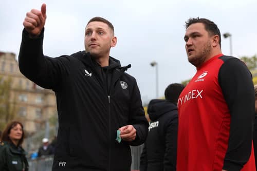 Finn Russell, left, of Bath in conversation with Jamie George of Saracens ahead of the Gallagher Premiership Rugby match between Bath Rugby and Saracens at The Recreation Ground on April 26, 2024 in Bath, England. (Photo by Michael Steele/Getty Images)