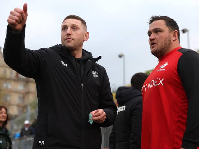 Finn Russell, left, of Bath in conversation with Jamie George of Saracens ahead of the Gallagher Premiership Rugby match between Bath Rugby and Saracens at The Recreation Ground on April 26, 2024 in Bath, England. (Photo by Michael Steele/Getty Images)