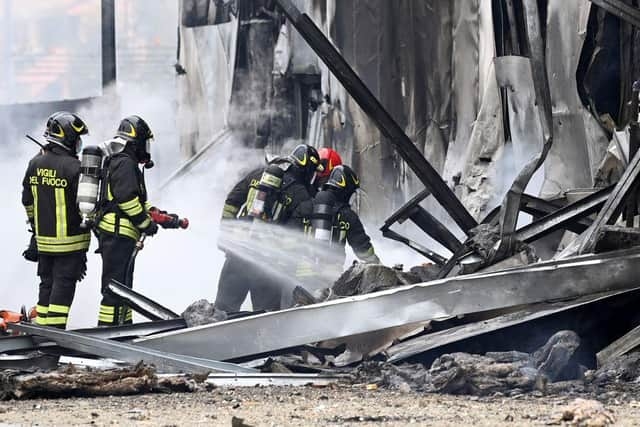 Firefighters were on the scene quickly to stop the flames caused by the plane crash in Milan. Photo: REUTERS/Flavio Lo Scalzo.