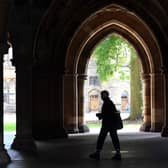 A student walks in the campus of Glasgow University. (Photo by Andy Buchanan / AFP) (Photo by ANDY BUCHANAN/AFP via Getty Images)