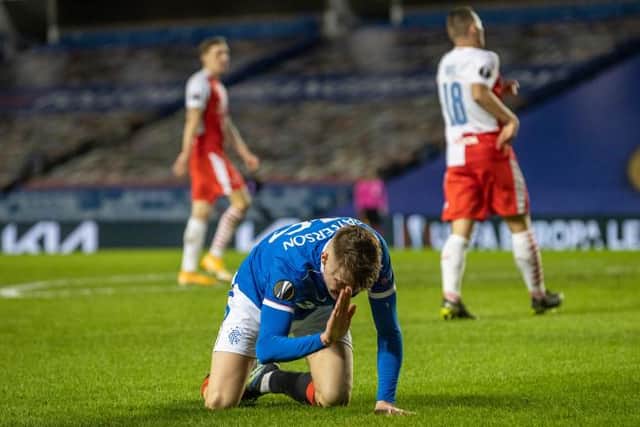 Nathan Patterson beats the turf in frustration at Ibrox on Thursday night. The teenage right-back picked up a calf injury and is a doubt for Sunday's Old Firm match. (Photo by Alan Harvey / SNS Group)