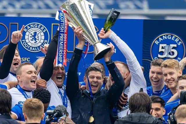 Steven Gerrard holds aloft the Scottish Premiership trophy as Rangers celebrate their first title triumph for a decade. (Photo by Craig Williamson / SNS Group)