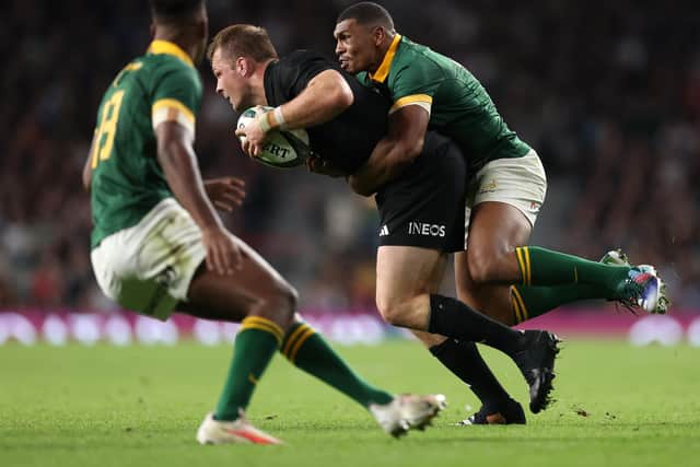 Sam Cane of New Zealand is tackled by Damian Willemse of South Africa - both teams are among the frontrunners to win the World Cup.