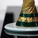 A picture taken on March 31, 2022 shows a detail of the World Cup Trophy during the FIFA Congress in the Qatari capital Doha. - The countdown towards the most controversial World Cup in history begins tomorrow as the draw for Qatar 2022 takes place in Doha 2022, less than eight months befor the start of the tournament itself. (Photo by FRANCK FIFE / AFP) (Photo by FRANCK FIFE/AFP via Getty Images)