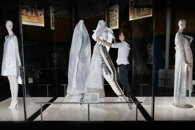 Collections care manager Anna Starkey unveils a Paco Rabanne mannequin in preparation for the reopening of the National Museum of Scotland on 19 August.