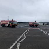 Fire engines surrounding the aircraft. Picture: Euan O'Donnell