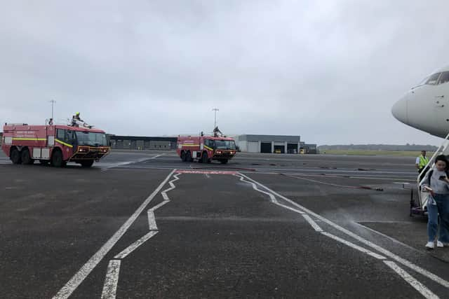 Fire engines surrounding the aircraft. Picture: Euan O'Donnell