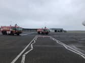 Fire engines surrounding the aircraft. Picture: Euan O'Donnell