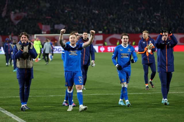 Scott Arfield leads the celebrations of the Rangers players in Belgrade after the Scottish champions qualified for the last eight of the Europa League. (Photo by Srdjan Stevanovic/Getty Images)