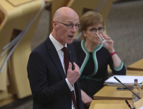 Nicola Sturgeon, seen looking on as John Swinney speaks in the Scottish Parliament, must be held to account by a strong opposition party over issues like poverty, says Susan Dalgety (Picture: Fraser Bremner/Scottish Daily Mail/via PA)