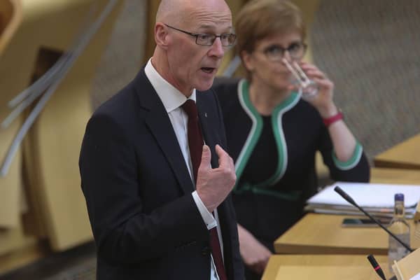 Nicola Sturgeon, seen looking on as John Swinney speaks in the Scottish Parliament, must be held to account by a strong opposition party over issues like poverty, says Susan Dalgety (Picture: Fraser Bremner/Scottish Daily Mail/via PA)