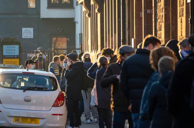 Queuing for a Covid-19 booster in Edinburgh, December 2021.