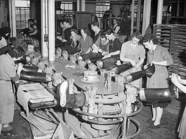 Making Wellington boots in the North British Rubber Company's works at Castle Mills in 1951.