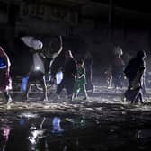 Palestinians displaced by the Israeli air and ground offensive on the Gaza Strip flee from parts of Khan Younis following an evacuation order by the Israeli army (Picture: AP Photo/Jehad Alshrafi)
