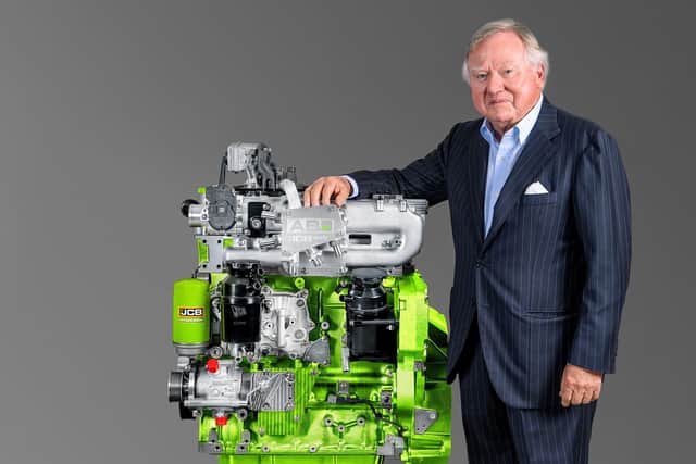 Lord Bamford with JCB’s pioneering hydrogen engine for agricultural and construction machinery.
