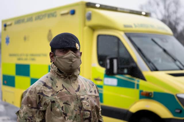 A member of the military poses for a photograph after the Welsh Ambulance Service called on the Army for support in December. Photo by Matthew Horwood/Getty Images