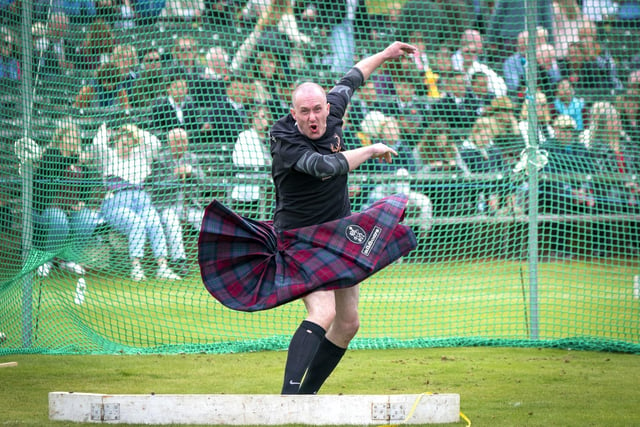 A participant competes in the weight throw during the Braemar Royal Highland Gathering
